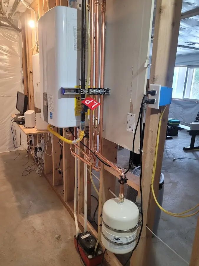 Licensed plumber repairing a kitchen sink in Raritan